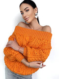 May include: A bright orange off-the-shoulder sweater with a chunky cable knit pattern.