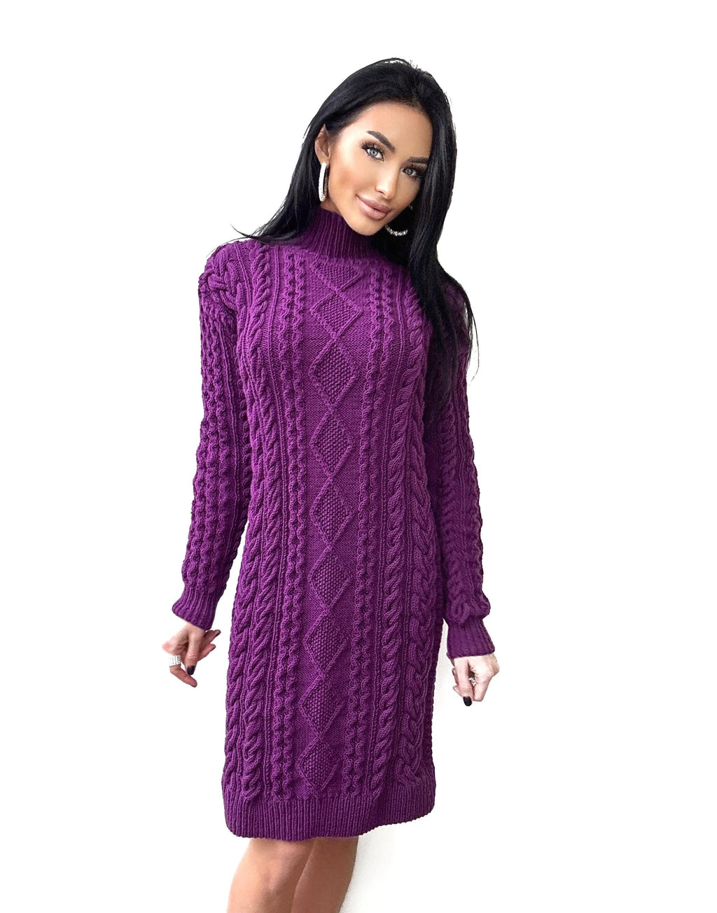 May include: A long-sleeved, knee-length dress in a vibrant purple hue. The dress features a turtleneck and a cable-knit design with diamond patterns. The knitted fabric provides a textured appearance, suitable for cooler weather.